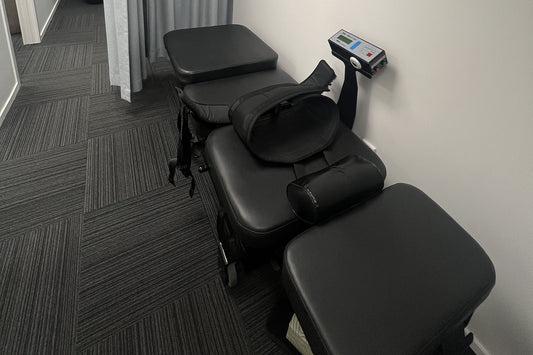 Win Trac 100 spinal decompression table with pelvic harness at Auckland Wellness Centre